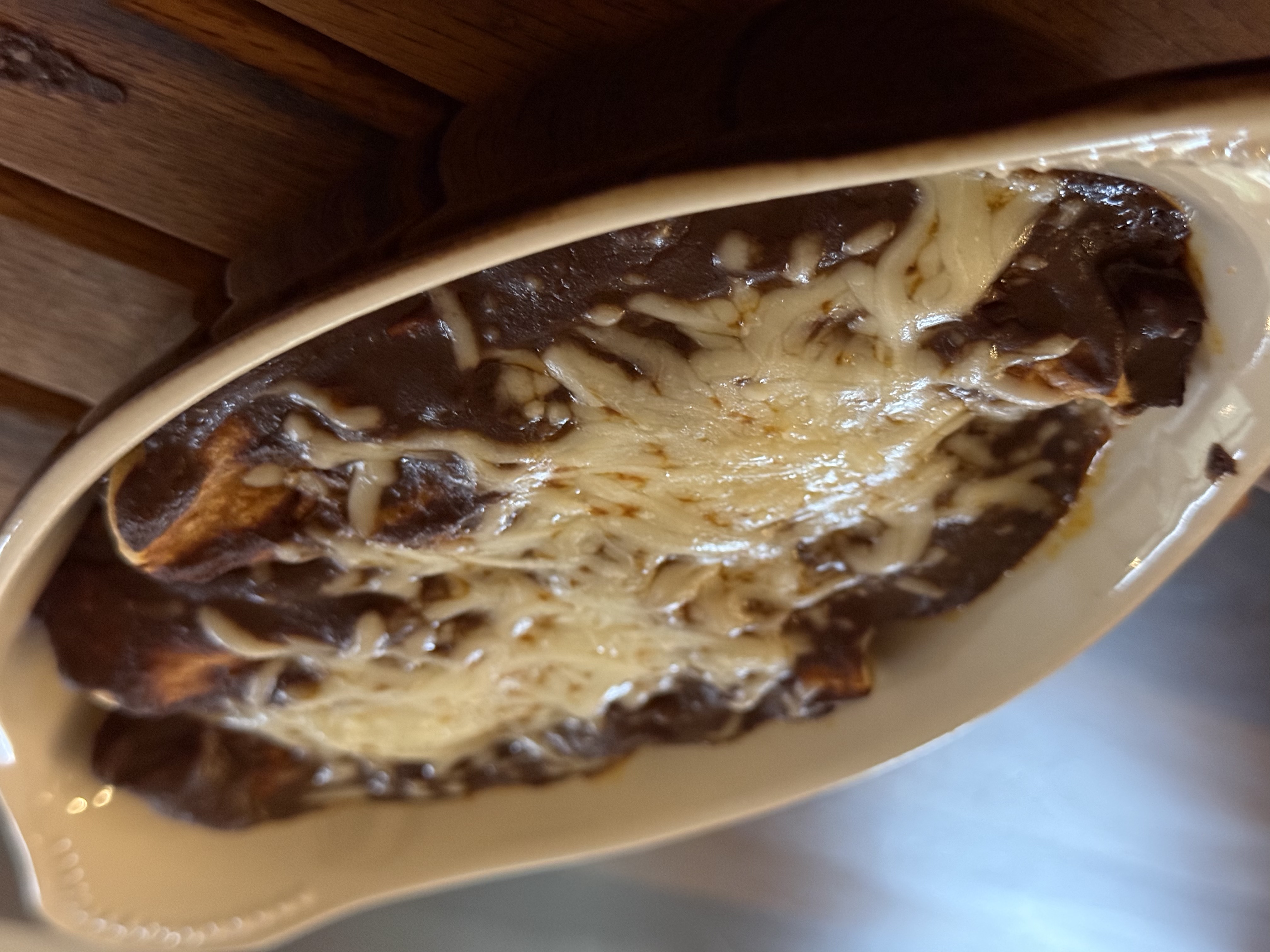Chicken mole enchiladas drenched in mole negro