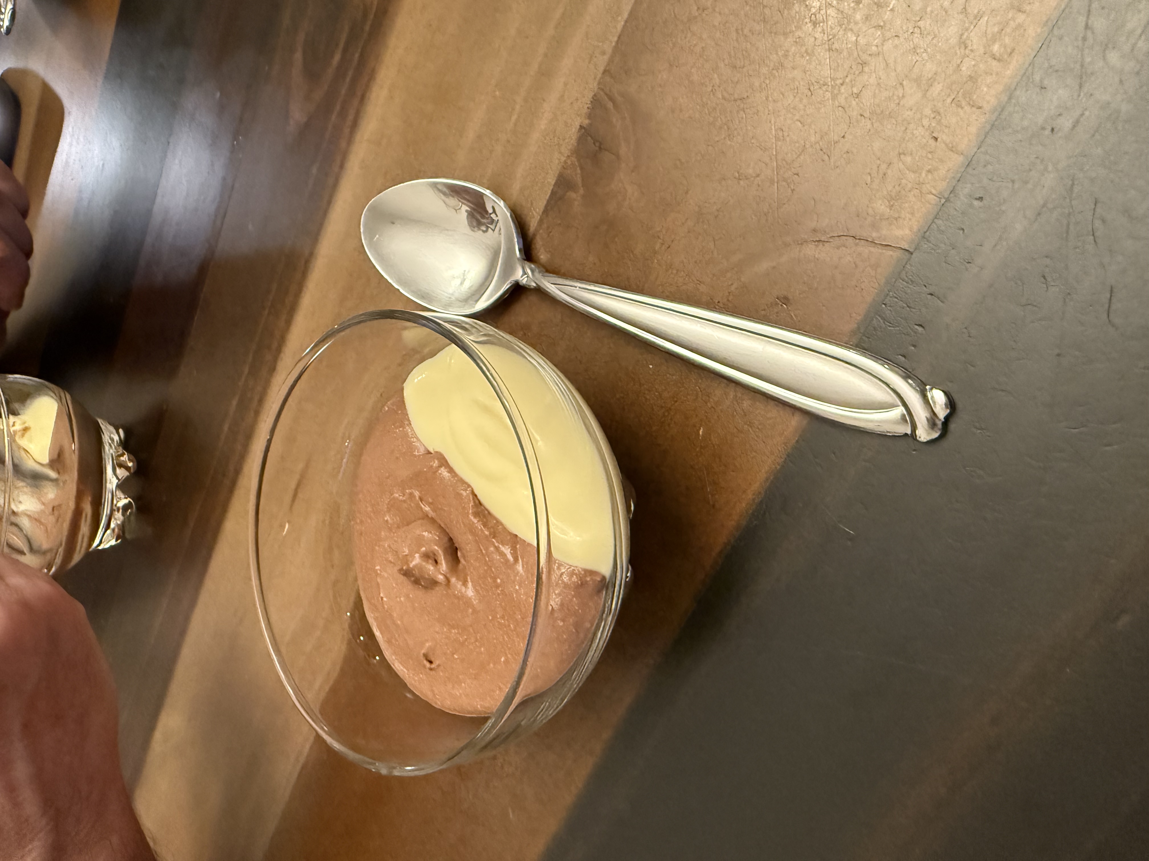Chocolate mousse with crème anglaise in a glass bowl