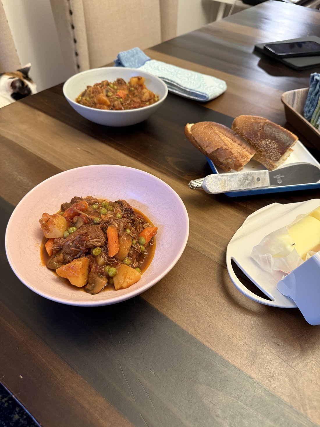 Hearty beef stew with root vegetables served in a bowl with crusty bread