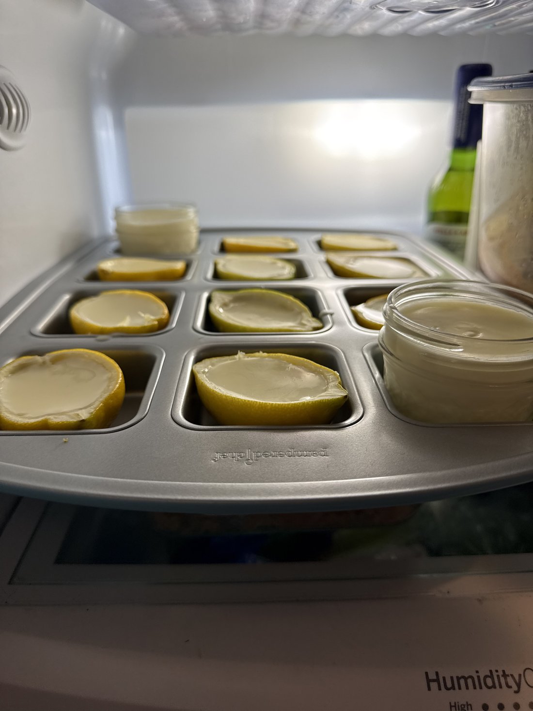 Lemon possets setting in the refrigerator in quilted mason jars